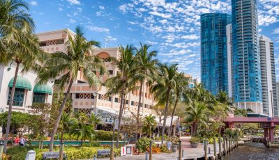 Fort Lauderdale, FL, one of our multiple locations, showcases a scenic waterfront with palm trees, luxury high-rises, and a vibrant promenade of shops and restaurants.